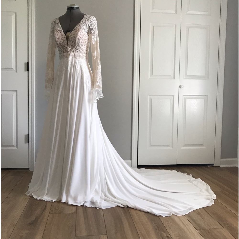 Open back, A-line  with flared cuffs and plunging neckline.